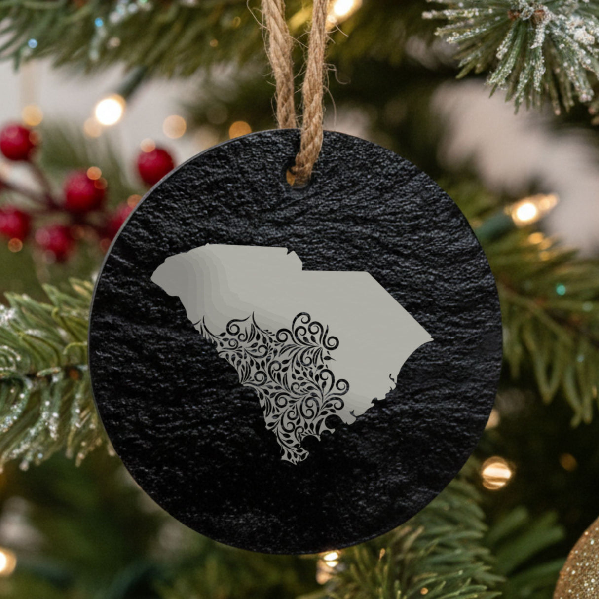 South Carolina round slate Christmas ornament engraved with the state shape in ornate floral scrollwork