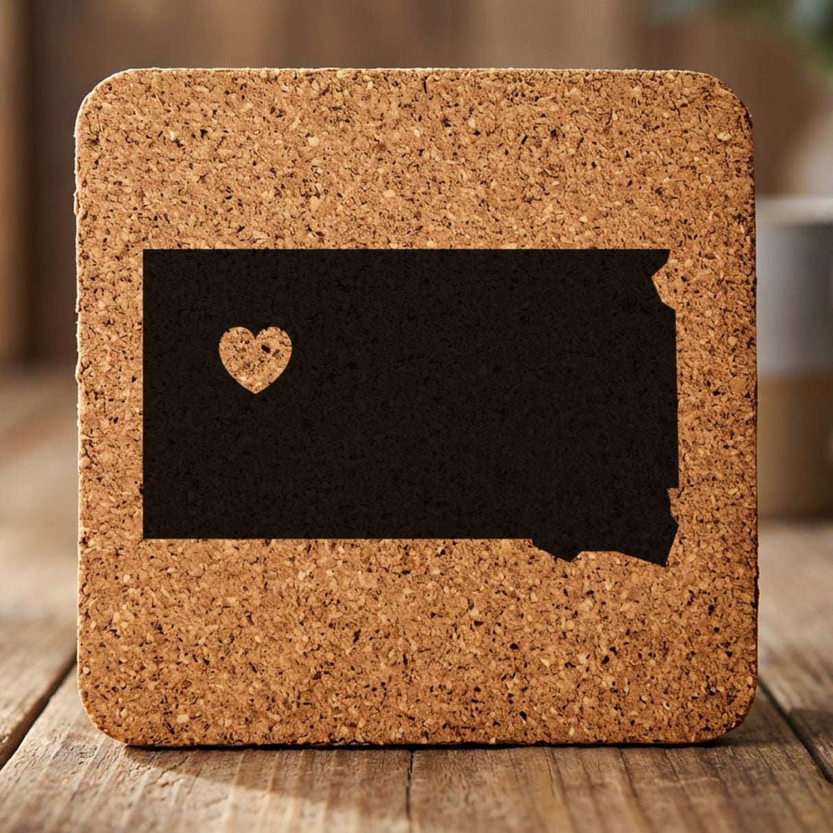 South Dakota square cork coaster engraved with the state shape and a heart