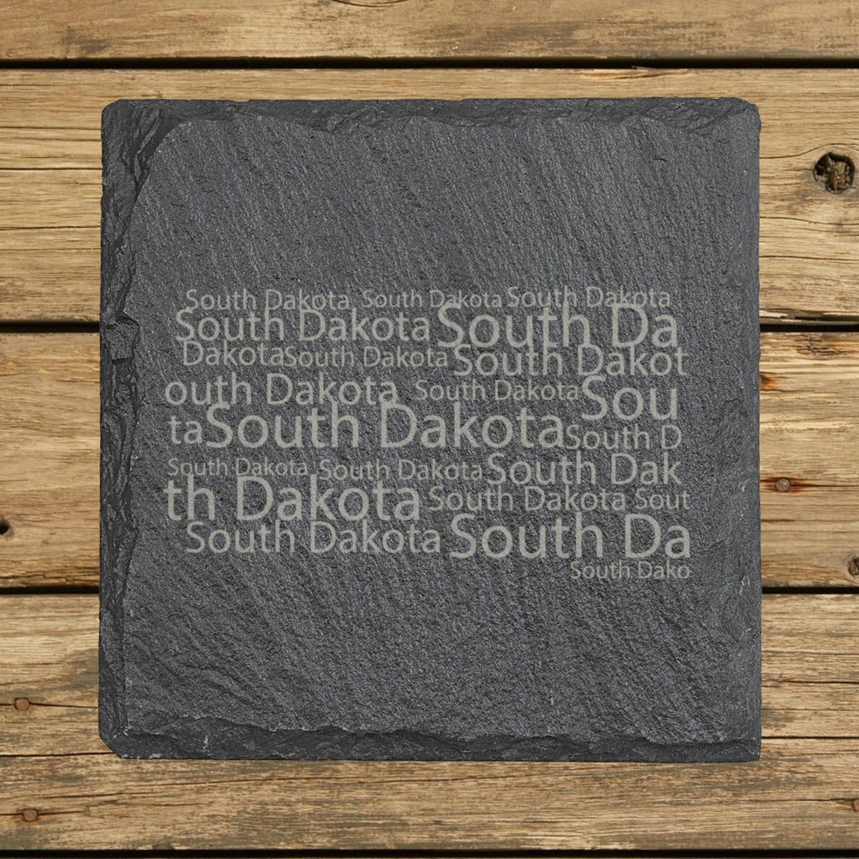 South Dakota square slate coaster engraved with a word cloud of repeating South Dakota text