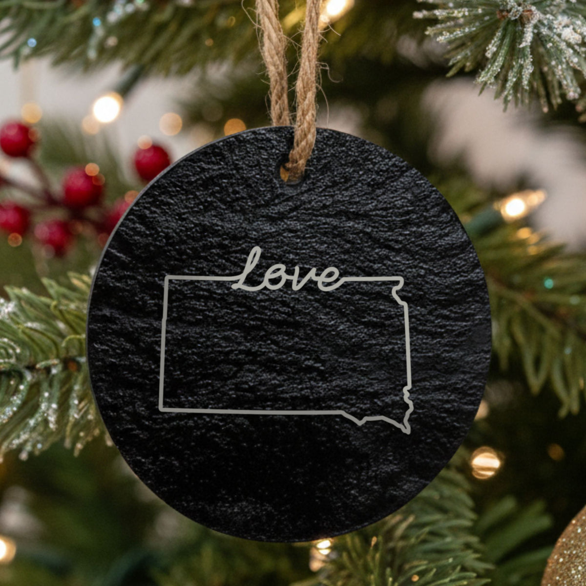 South Dakota round slate Christmas ornament engraved with a hand-drawn state outline and love in cursive