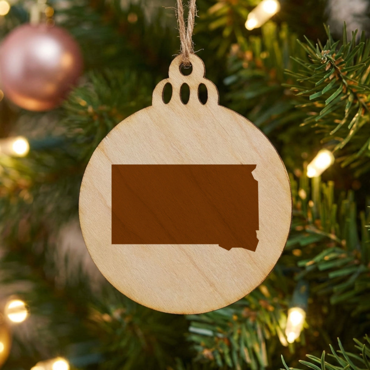 South Dakota round wood Christmas ornament with the full state shape engraved