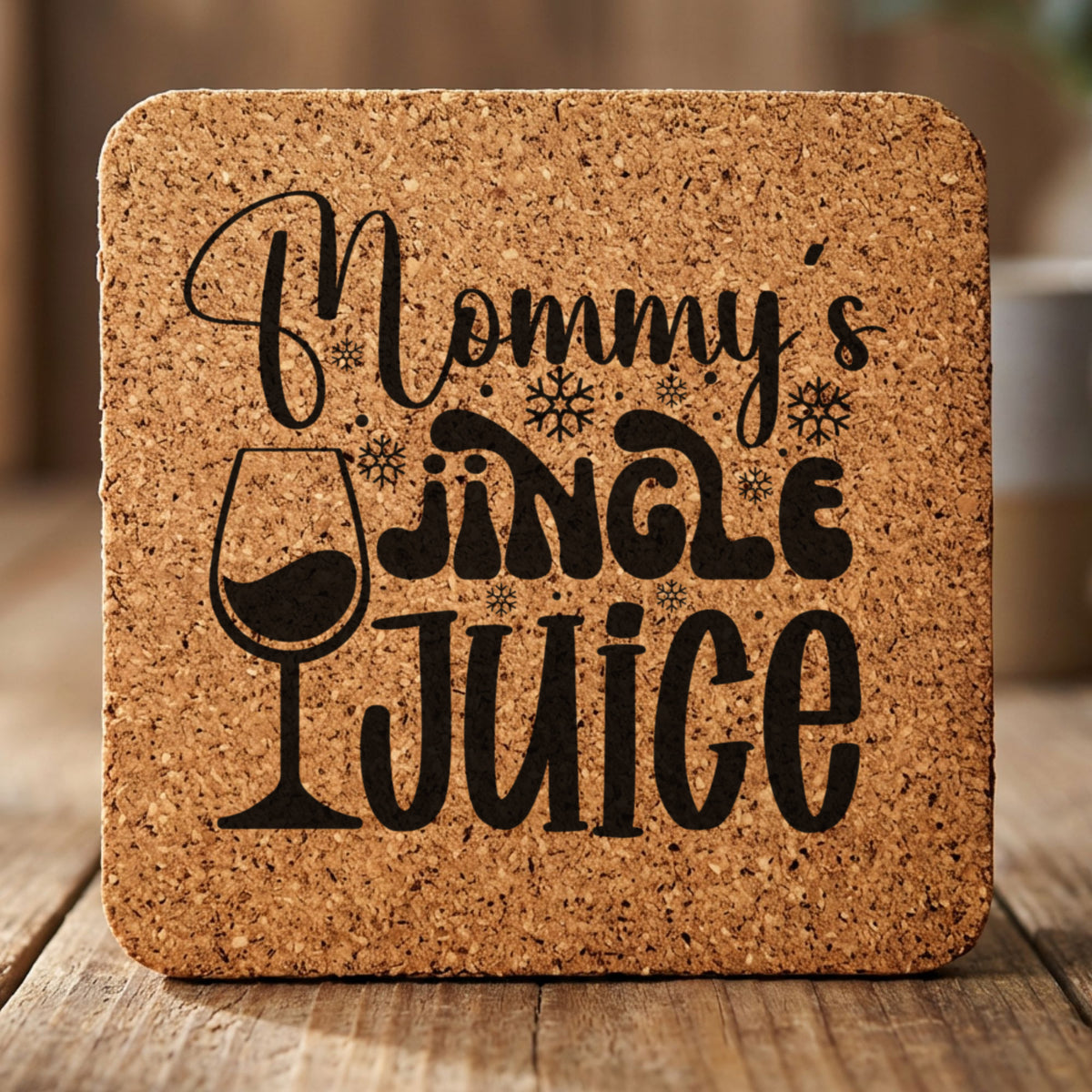 Square cork coaster laser engraved with "Mommy's Jingle Juice"