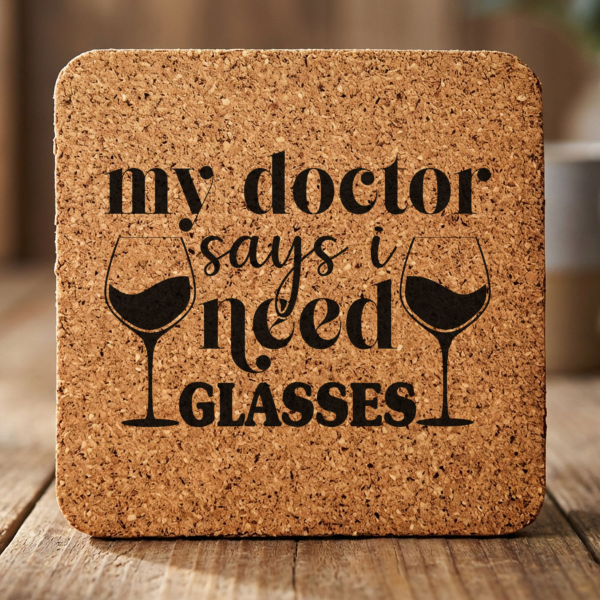 Square cork coaster laser engraved with "My Doctor Says I Need Glasses"