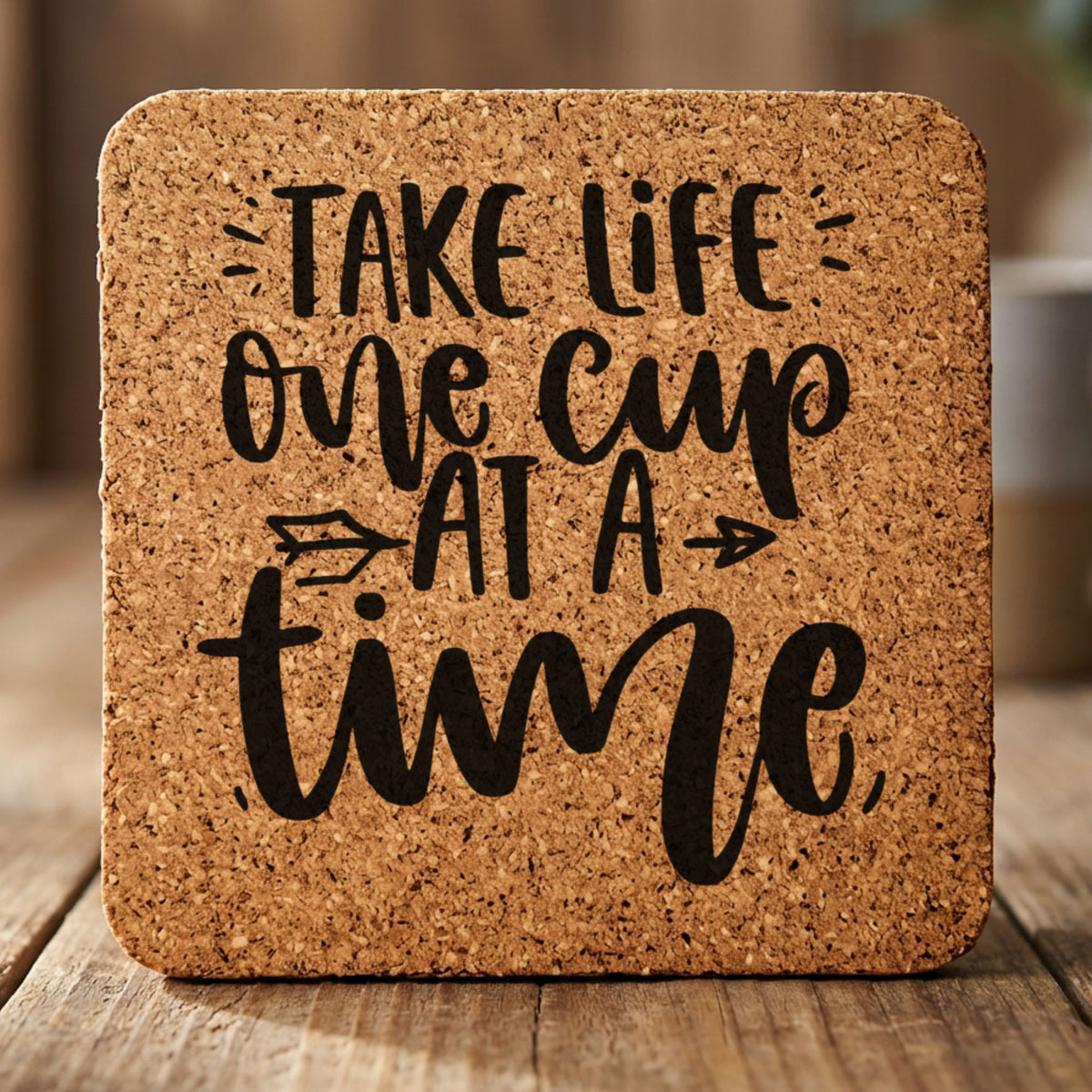 Square cork coaster laser engraved with "Take Life One Cup at a Time"