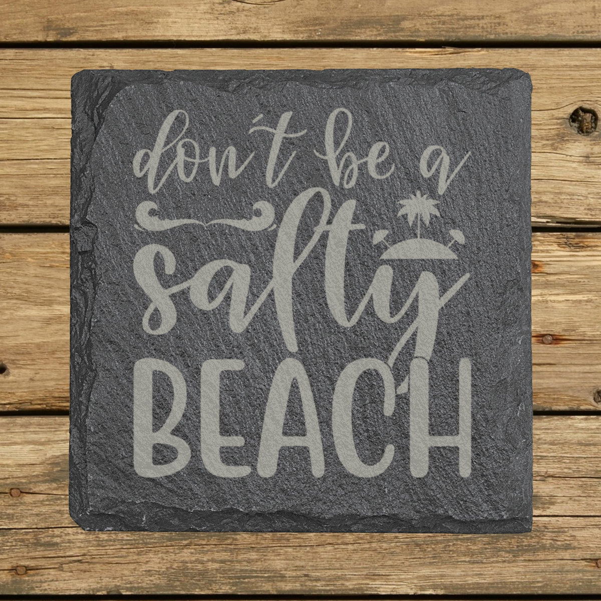 Square slate coaster laser engraved with "Don't Be a Salty Beach"