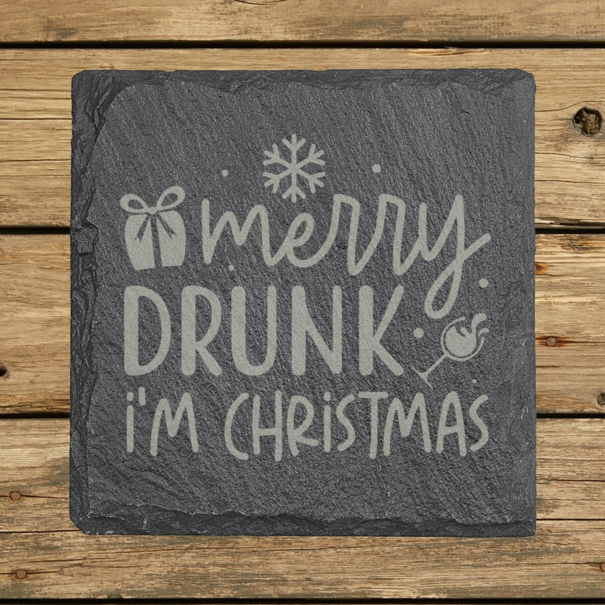 Square slate coaster laser engraved with "Merry Drunk I'm Christmas"