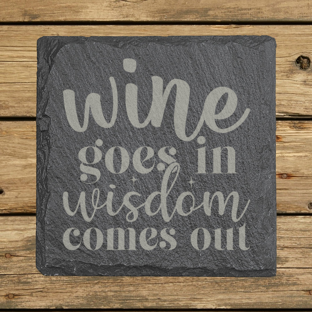 Square slate coaster laser engraved with "Wine Goes In, Wisdom Comes Out"