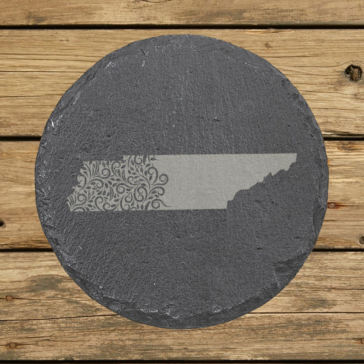 Tennessee round slate coaster engraved with the state shape in ornate floral scrollwork