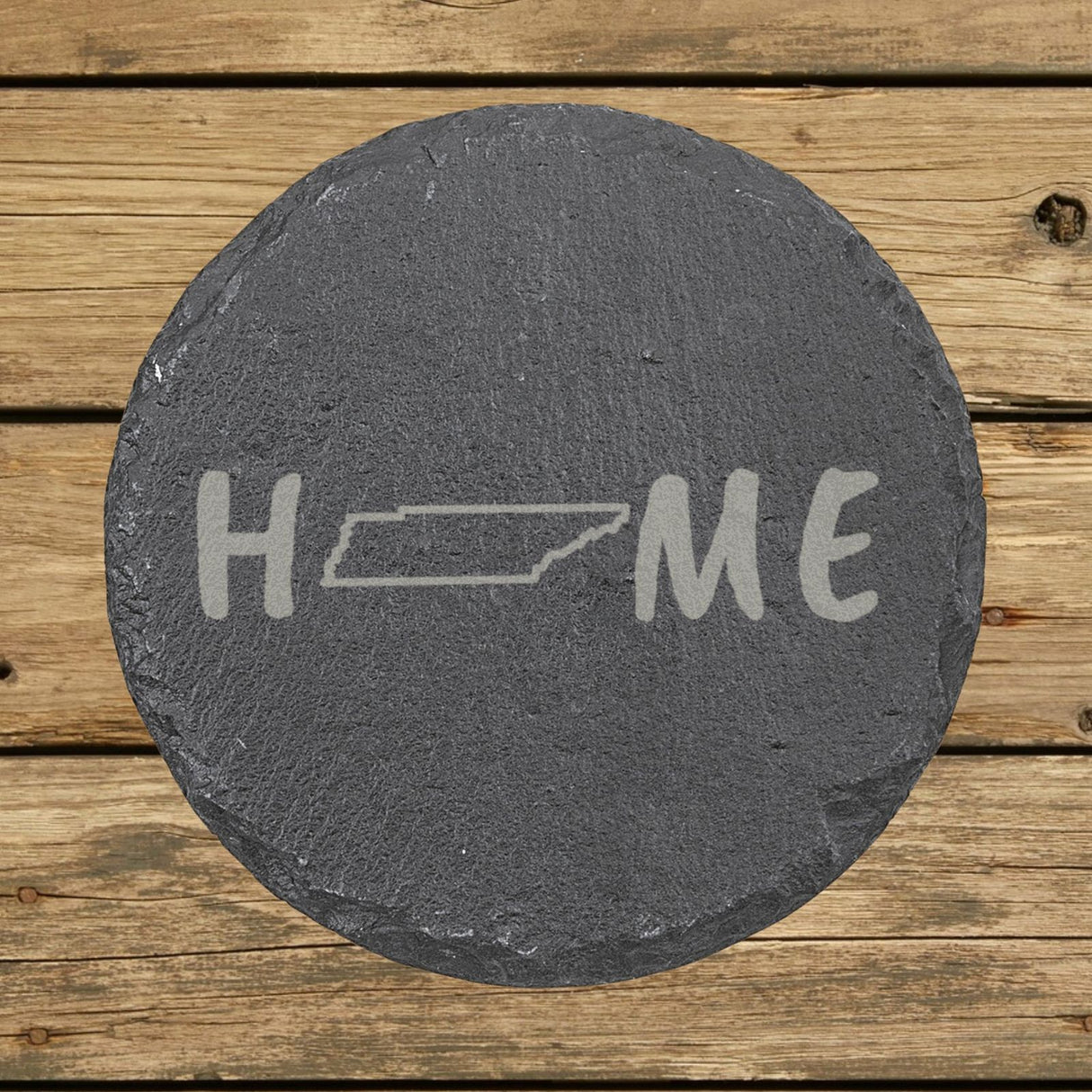 Tennessee round slate coaster engraved with HOME using the state outline as the letter O