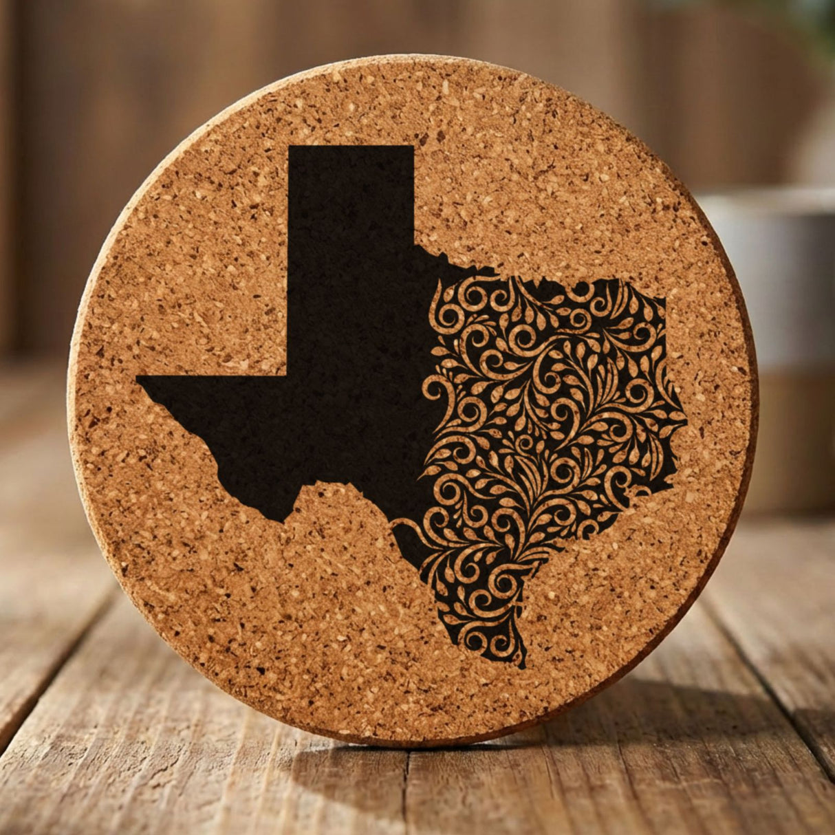 Texas round cork coaster engraved with the state shape in ornate floral scrollwork