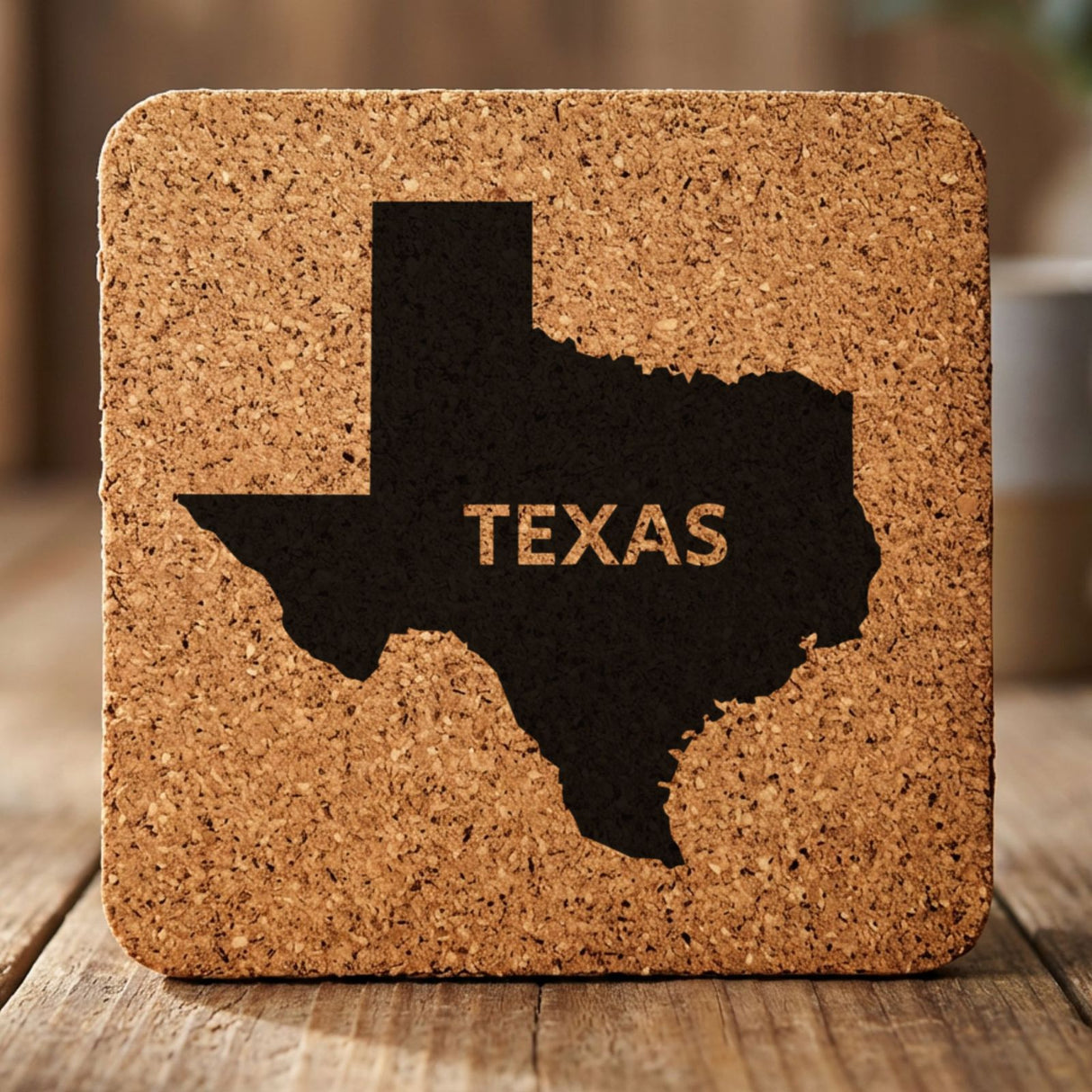 Texas square cork coaster engraved with the state shape and TEXAS in bold lettering