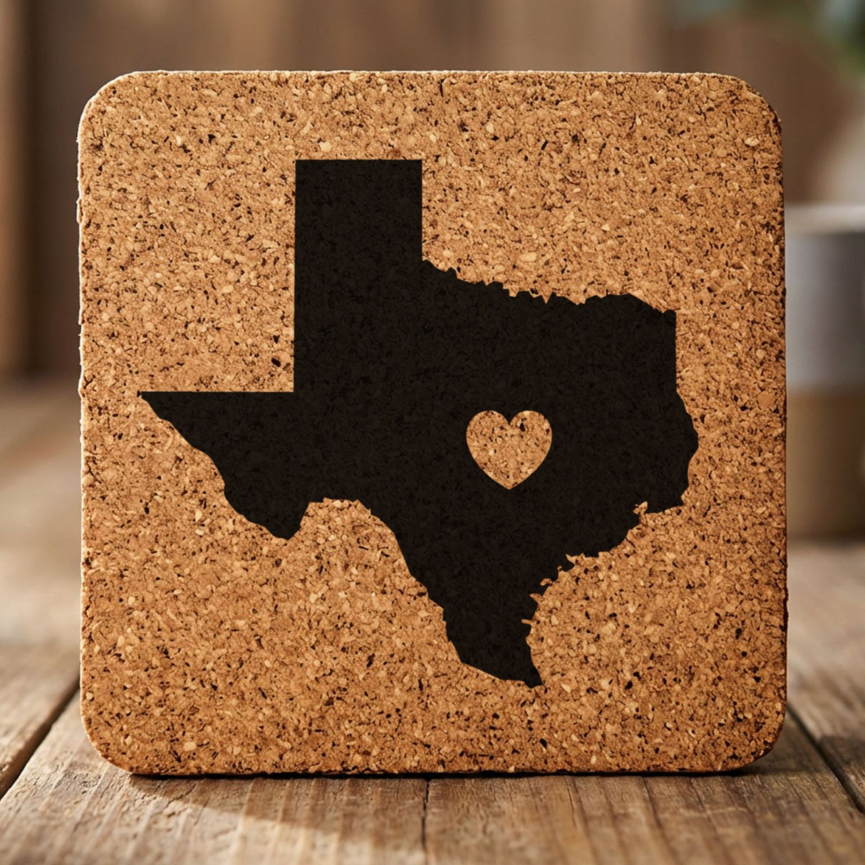 Texas square cork coaster engraved with the state shape and a heart