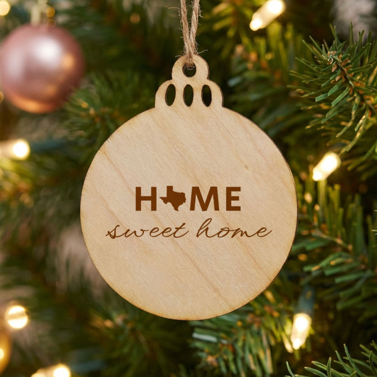 Texas round wood Christmas ornament engraved with HOME sweet home using the state shape as the letter O
