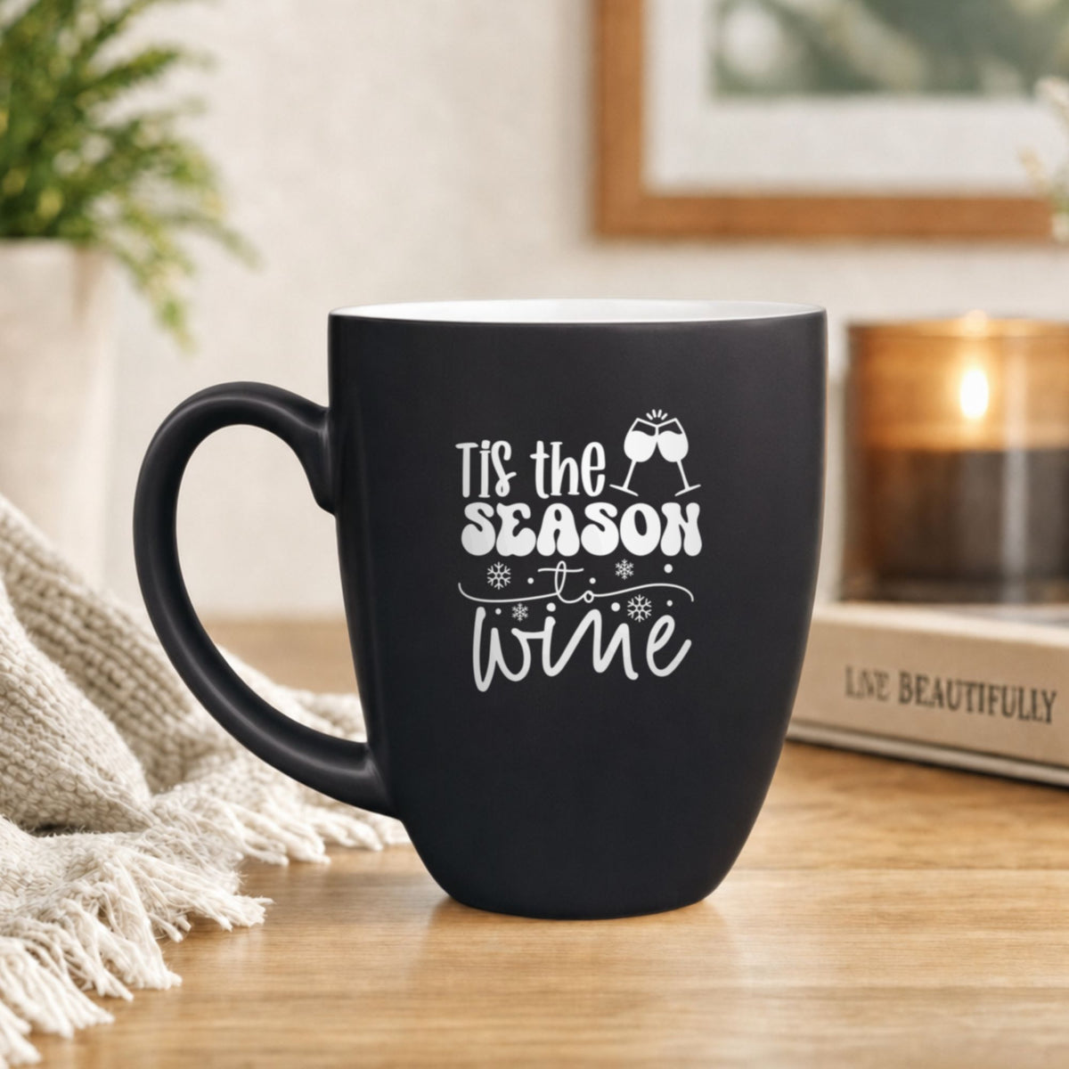 16 oz black ceramic coffee mug with "'Tis the Season to Wine"