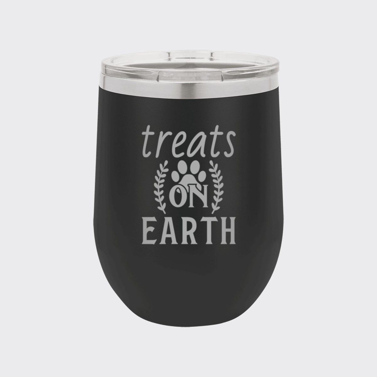 Black 12 oz stemless wine tumbler laser engraved with "Treats on Earth"