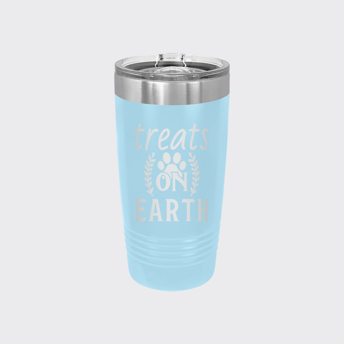 Light Blue 20 oz tumbler laser engraved with "Treats on Earth"