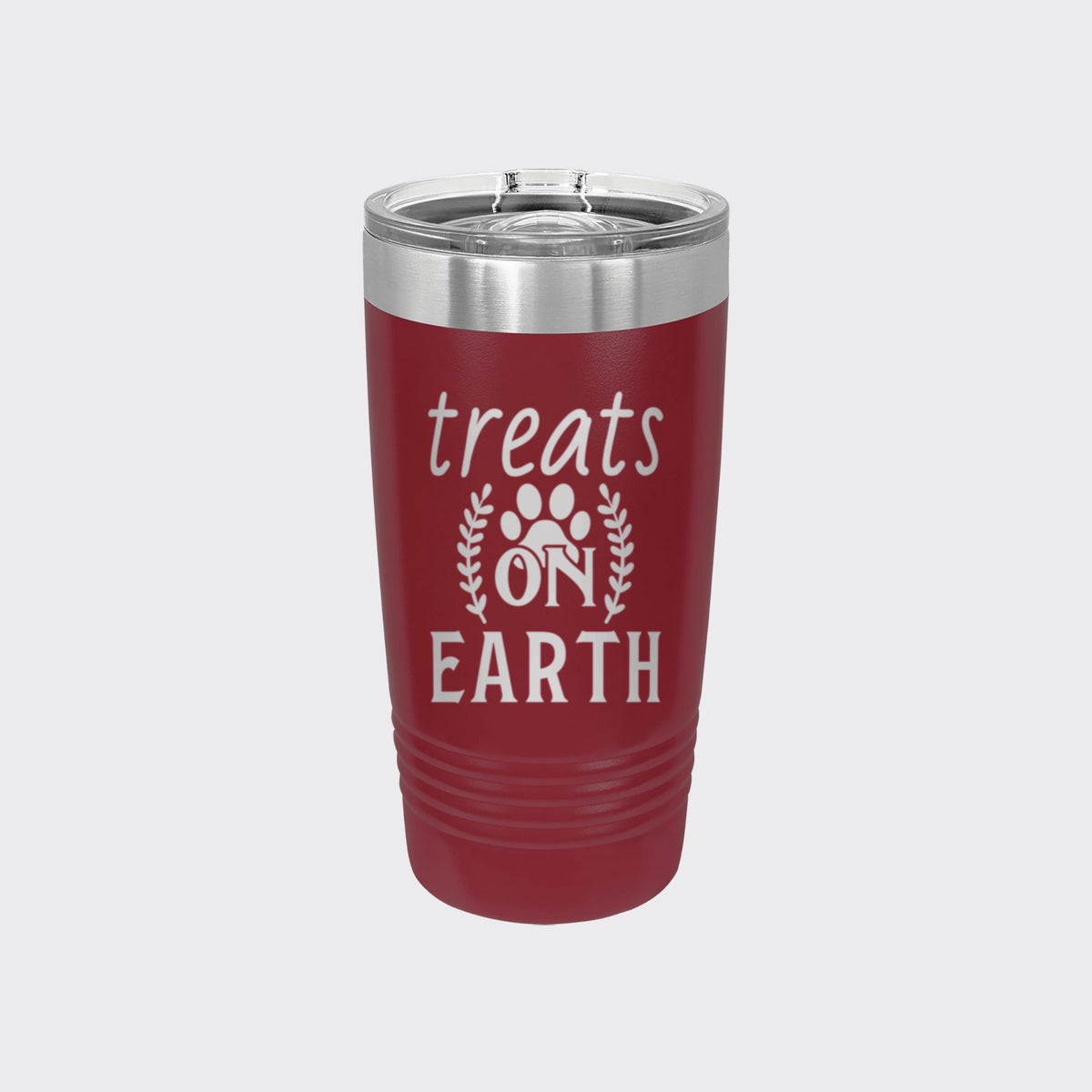 Maroon 20 oz tumbler laser engraved with "Treats on Earth"