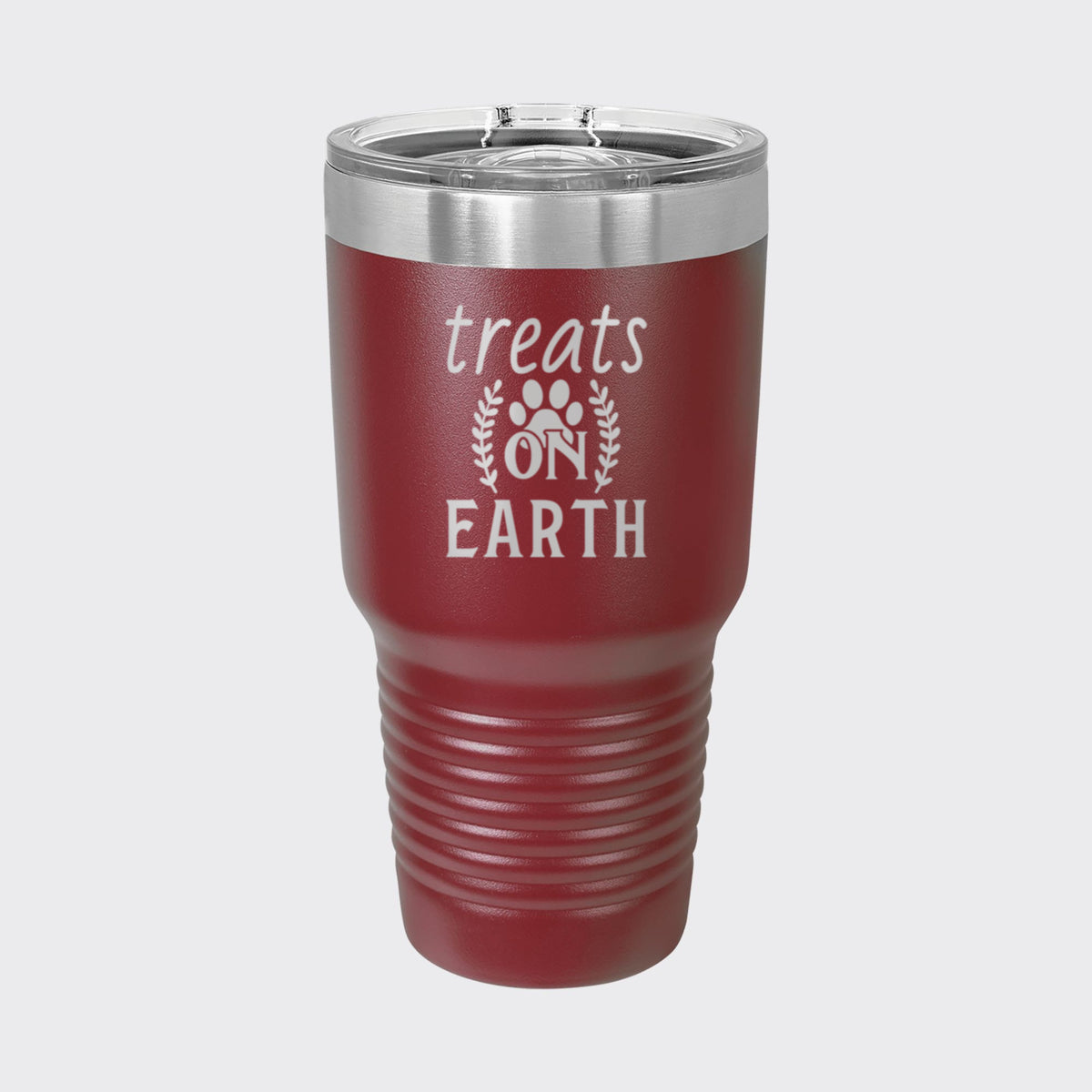 Maroon 30 oz tumbler laser engraved with "Treats on Earth"