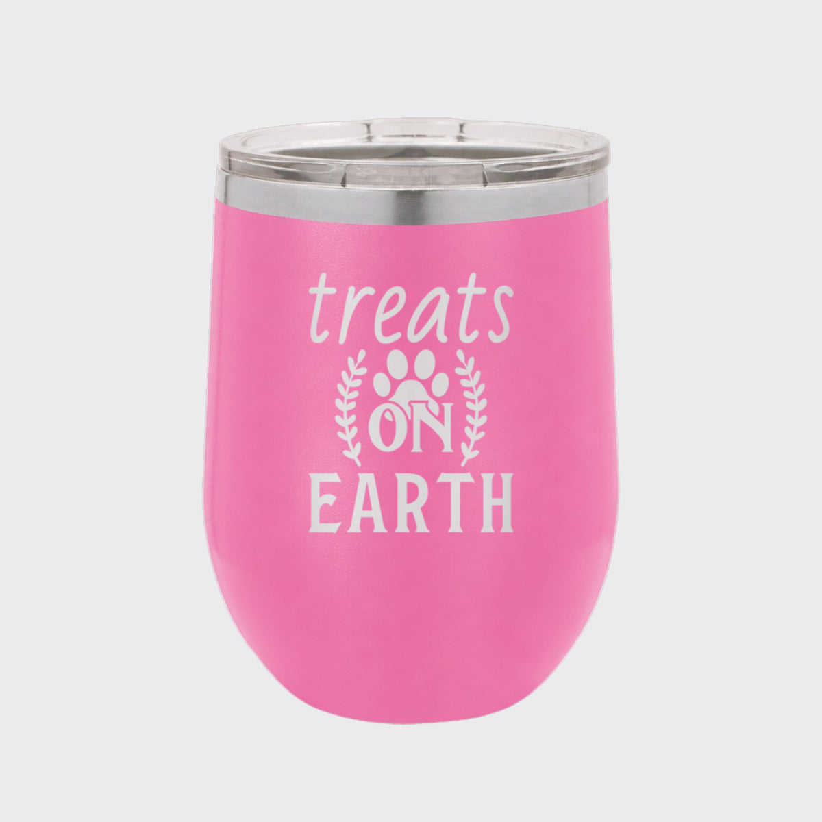 Pink 12 oz stemless wine tumbler laser engraved with "Treats on Earth"