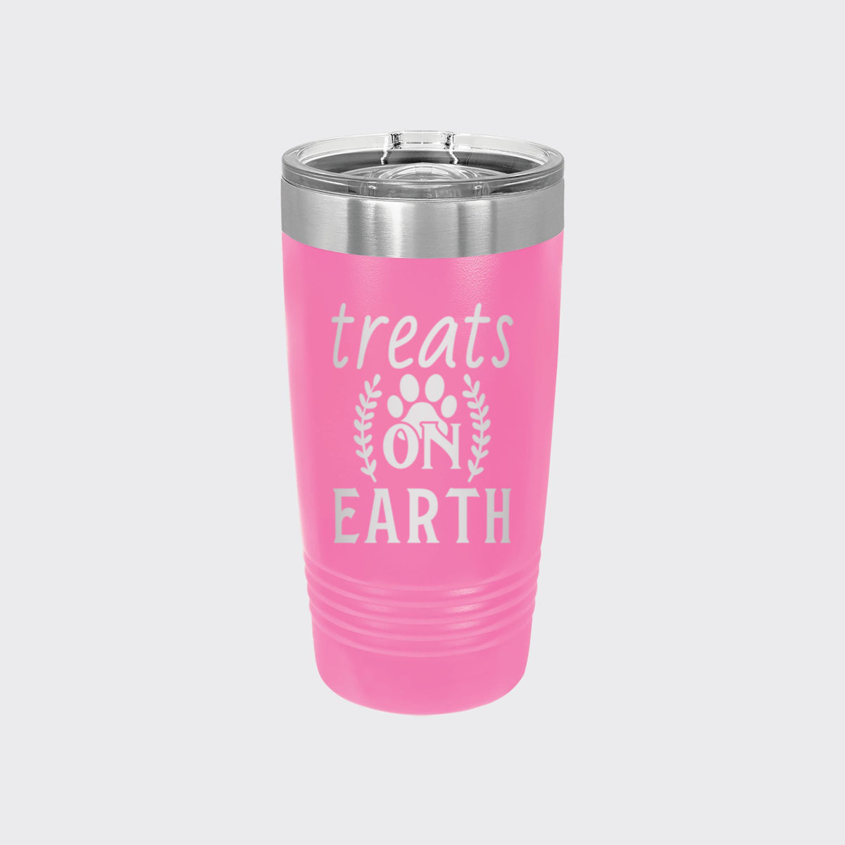 Pink 20 oz tumbler laser engraved with "Treats on Earth"