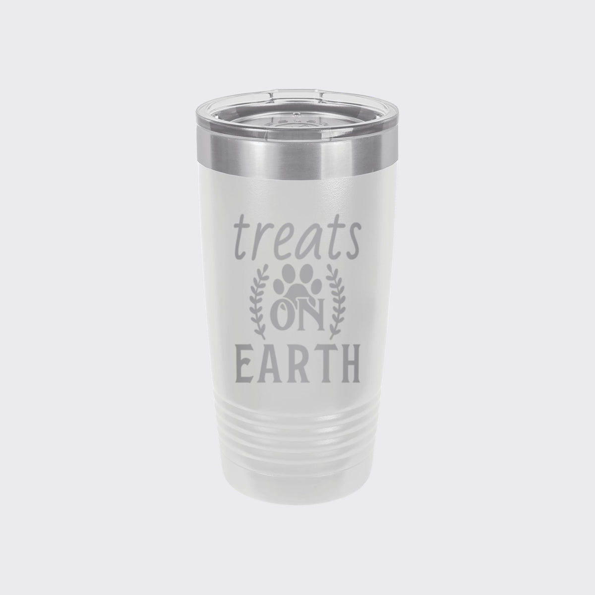 White 20 oz tumbler laser engraved with "Treats on Earth"