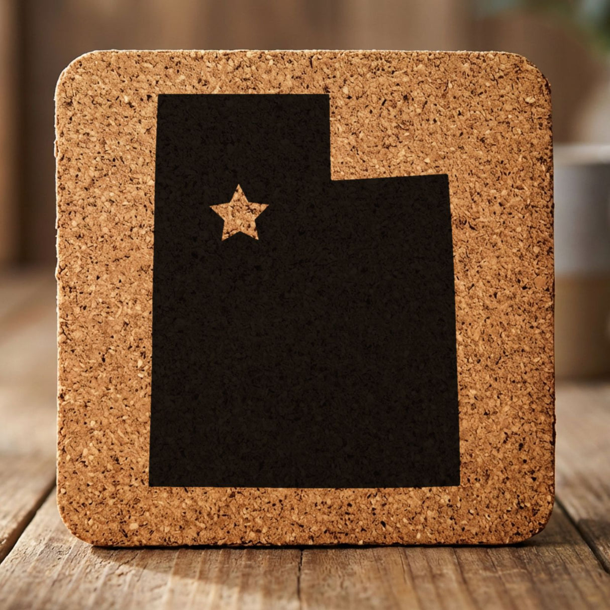 Utah square cork coaster engraved with the state shape and a star