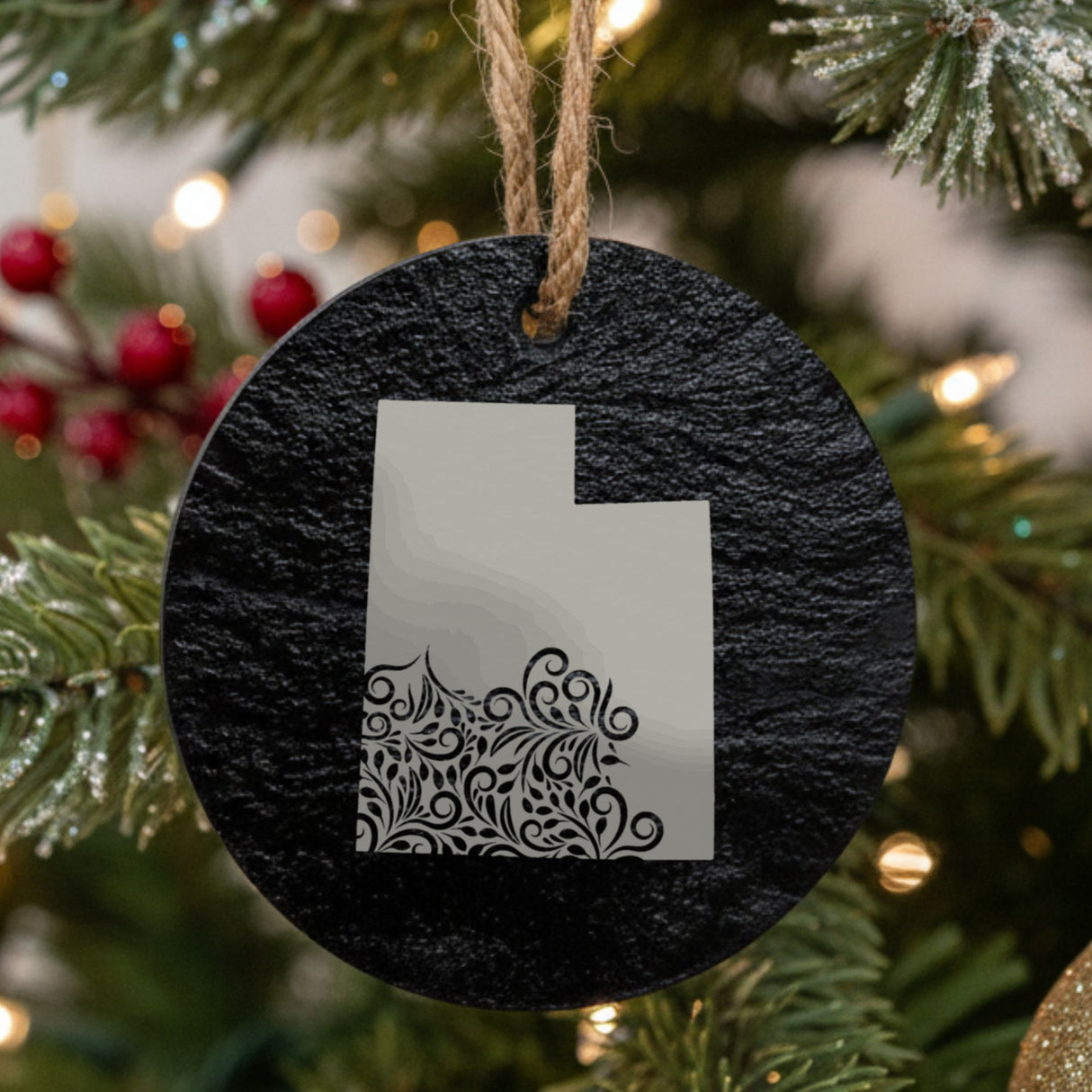 Utah round slate Christmas ornament engraved with the state shape in ornate floral scrollwork
