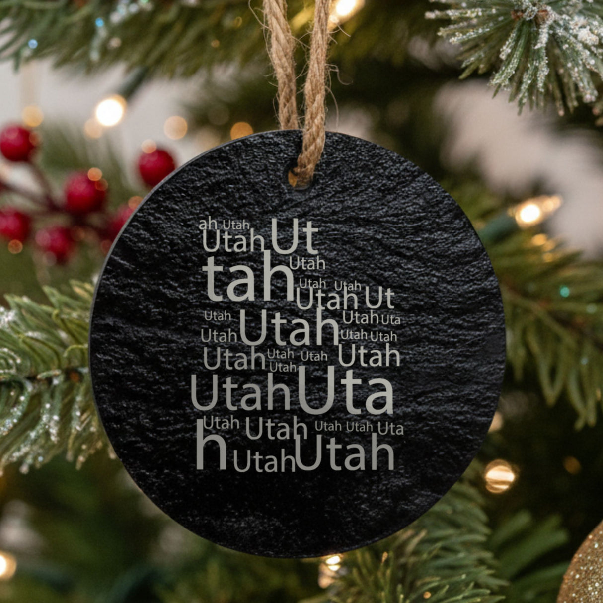 Utah round slate Christmas ornament engraved with a word cloud of repeating Utah text