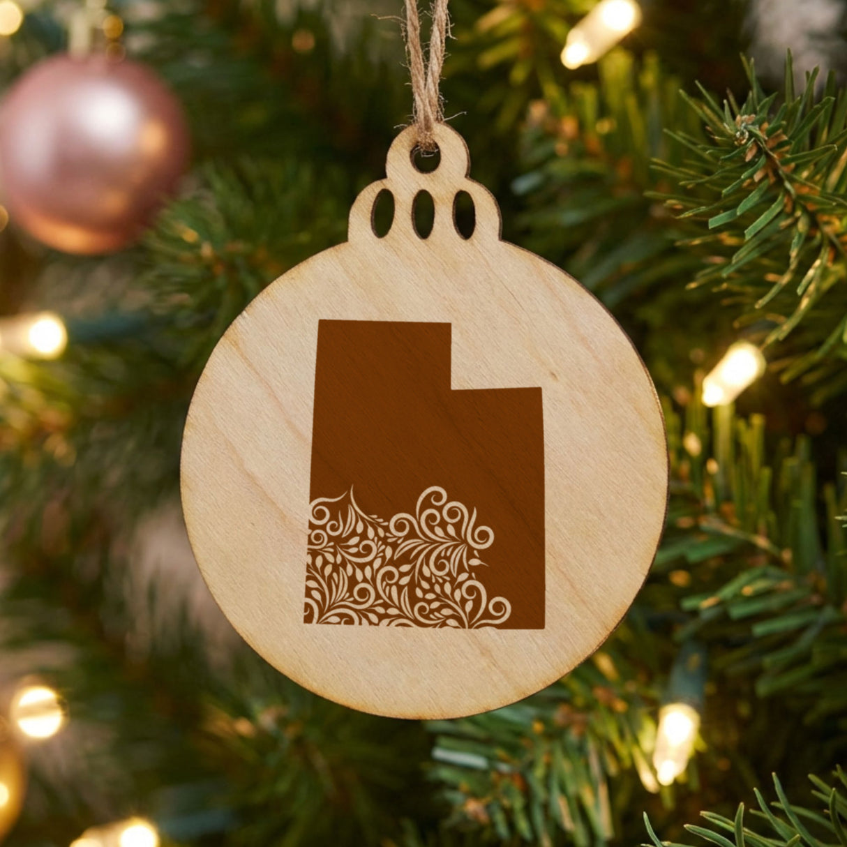 Utah round wood Christmas ornament engraved with the state shape in ornate floral scrollwork