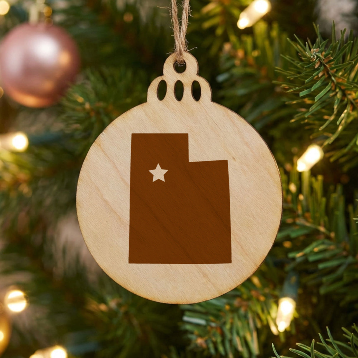 Utah round wood Christmas ornament engraved with the state shape and a star