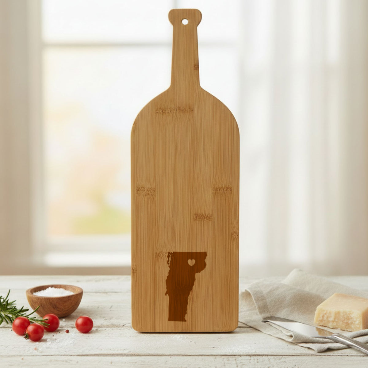 Bamboo wine bottle cutting board engraved with the Vermont Heart Accent design