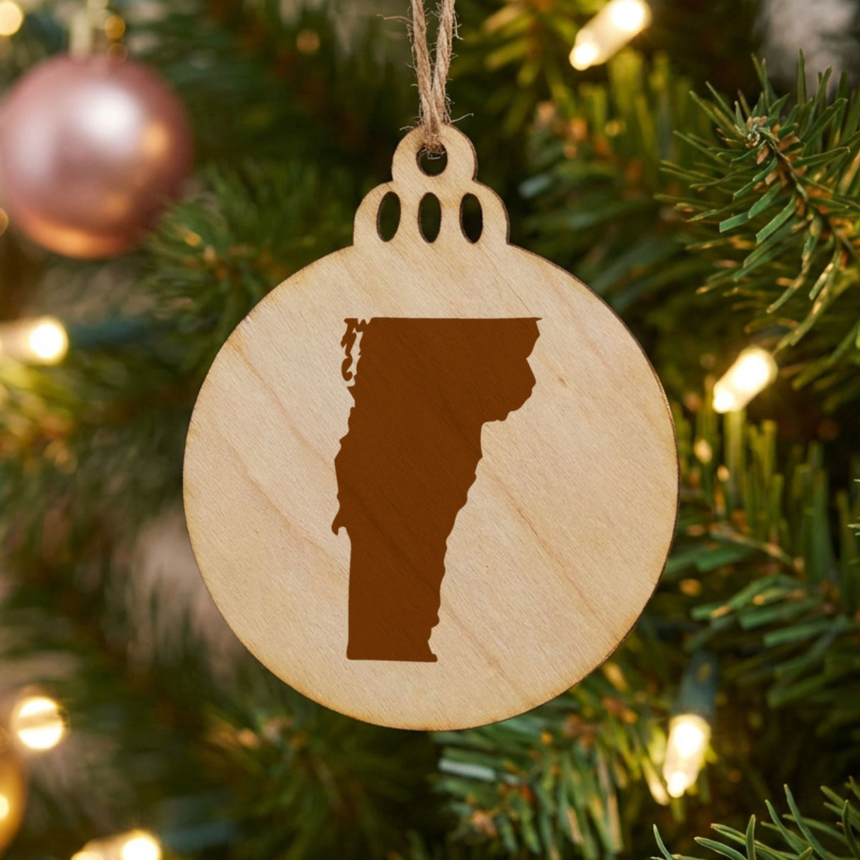 Vermont round wood Christmas ornament with the full state shape engraved