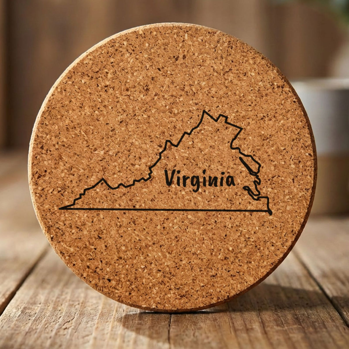 Virginia round cork coaster engraved with the state outline and VIRGINIA in hand-drawn brush lettering