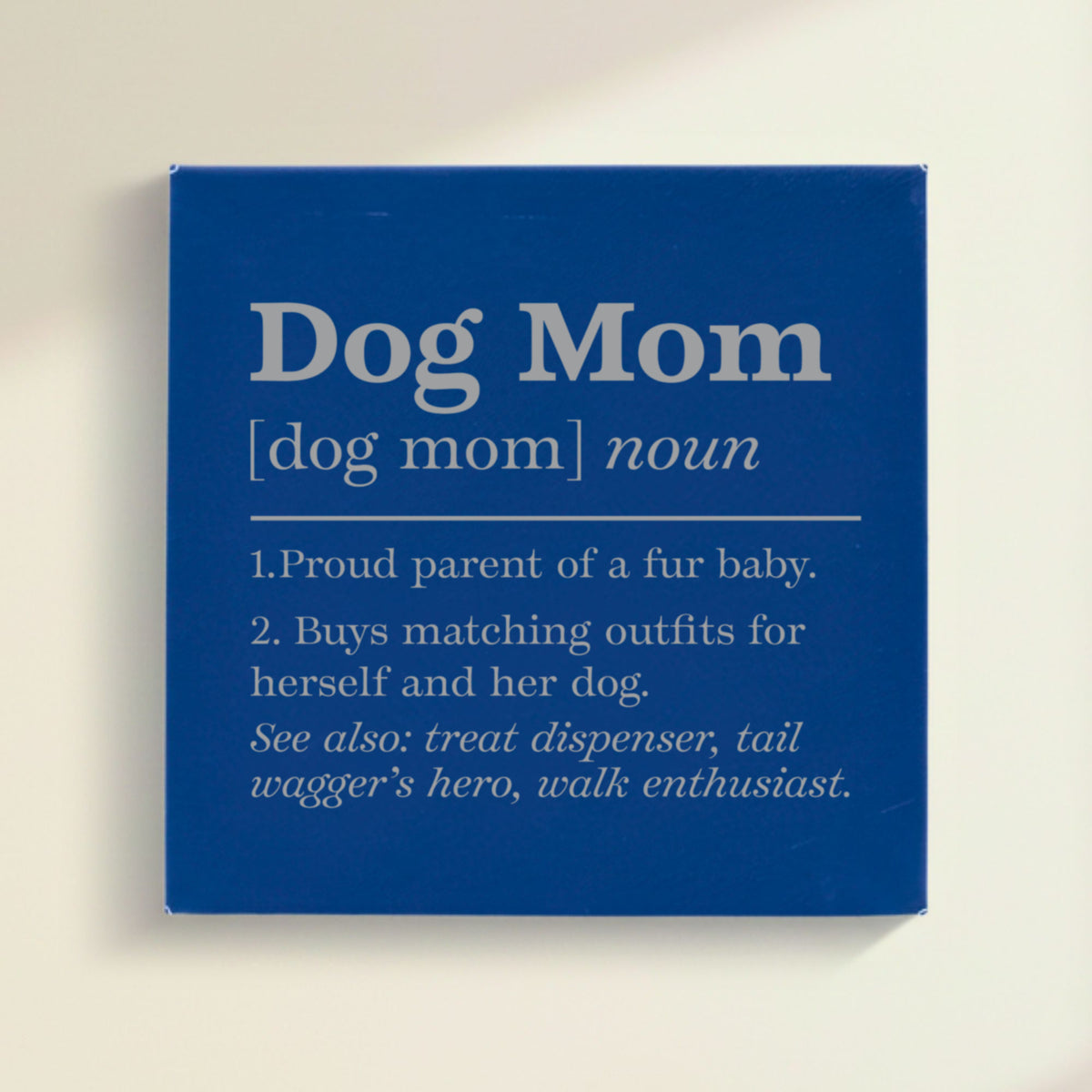 Close-up of the blue leatherette wall sign engraved with the Dog Mom dictionary definition