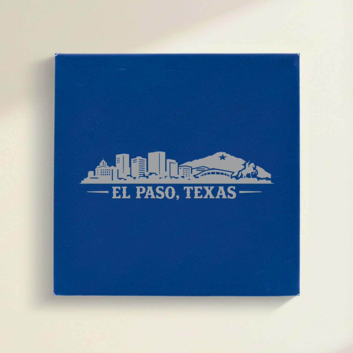 Close up of the El Paso, Texas skyline engraved on Blue leatherette