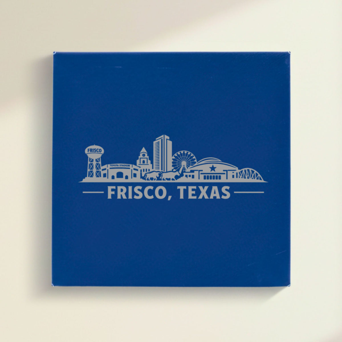 Close up of the Frisco, Texas skyline engraved on Blue leatherette