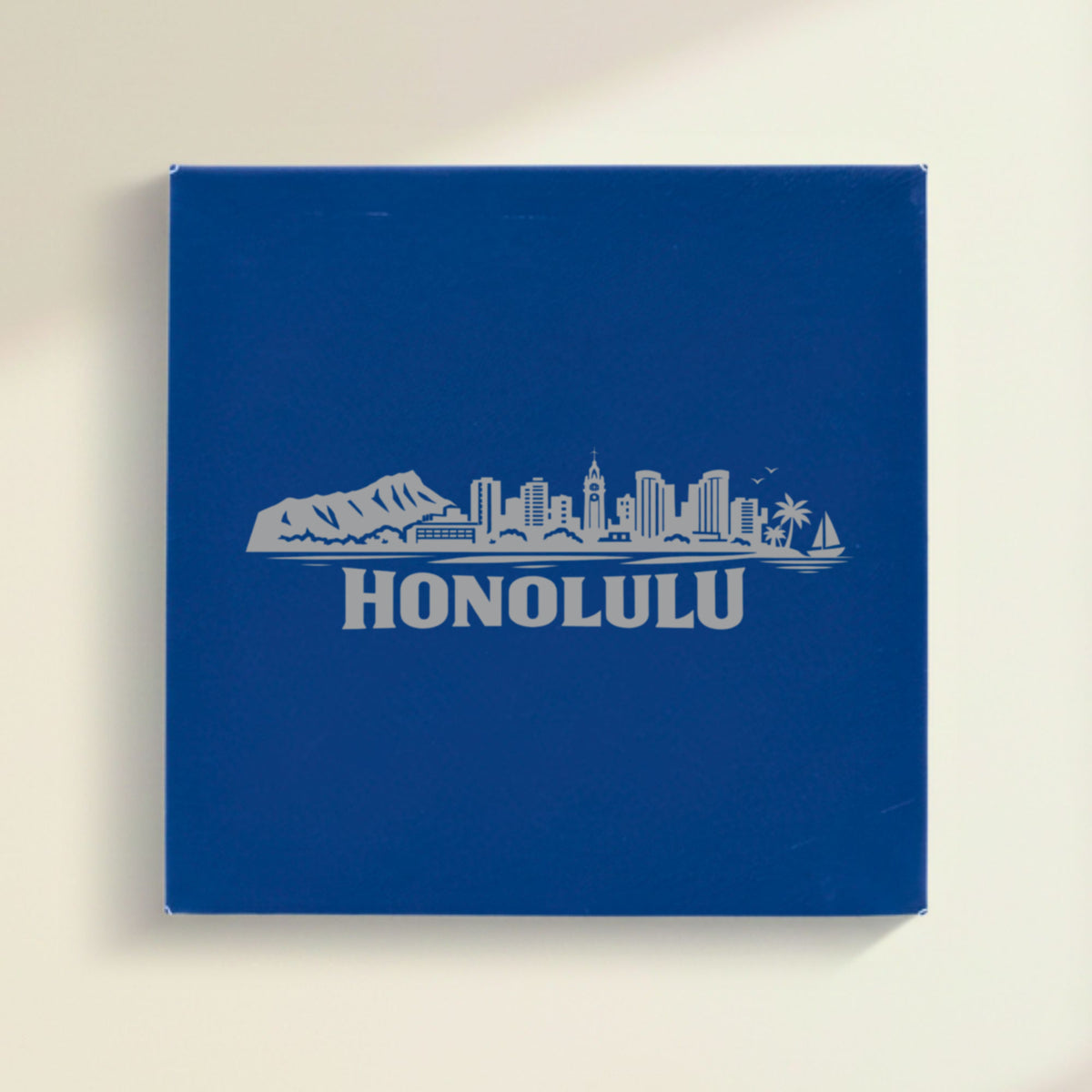 Close up of the Honolulu, Hawaii skyline engraved on Blue leatherette