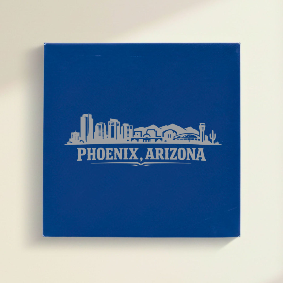 Close up of the Phoenix, Arizona skyline engraved on Blue leatherette