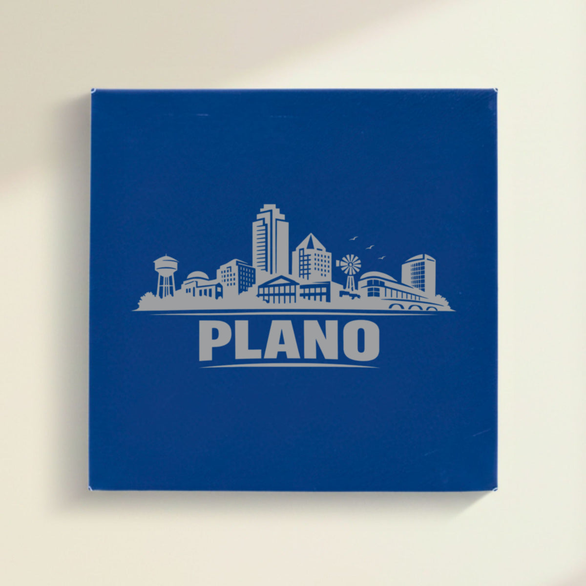 Close up of the Plano, Texas skyline engraved on Blue leatherette