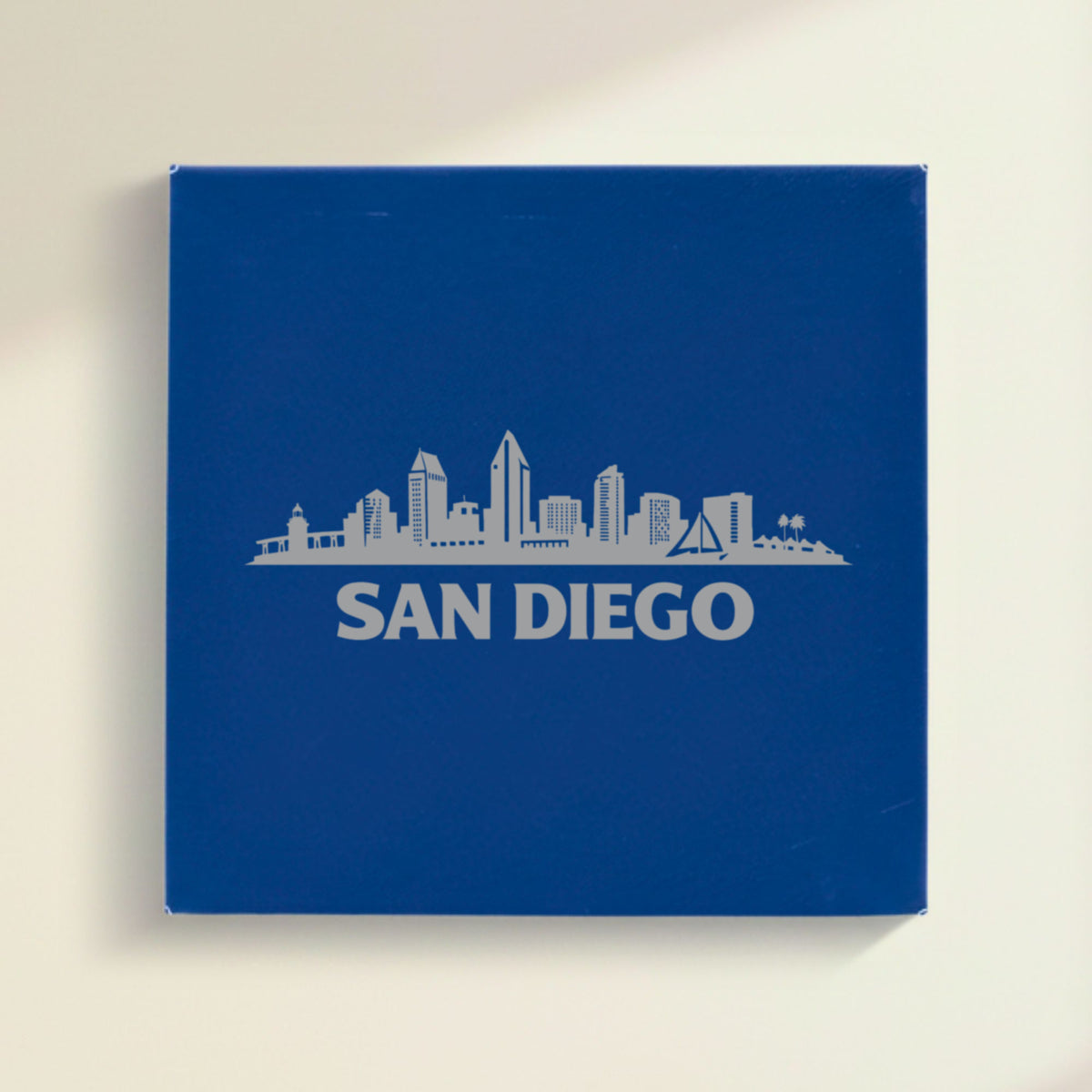 Close up of the San Diego, California skyline engraved on Blue leatherette