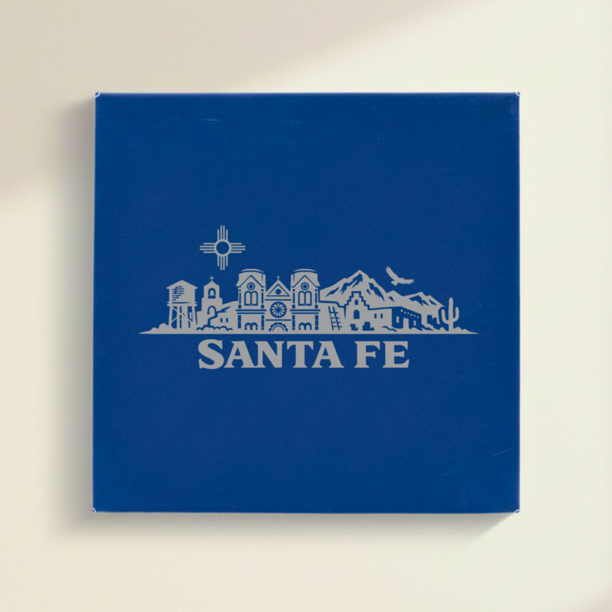 Close up of the Santa Fe, New Mexico skyline engraved on Blue leatherette
