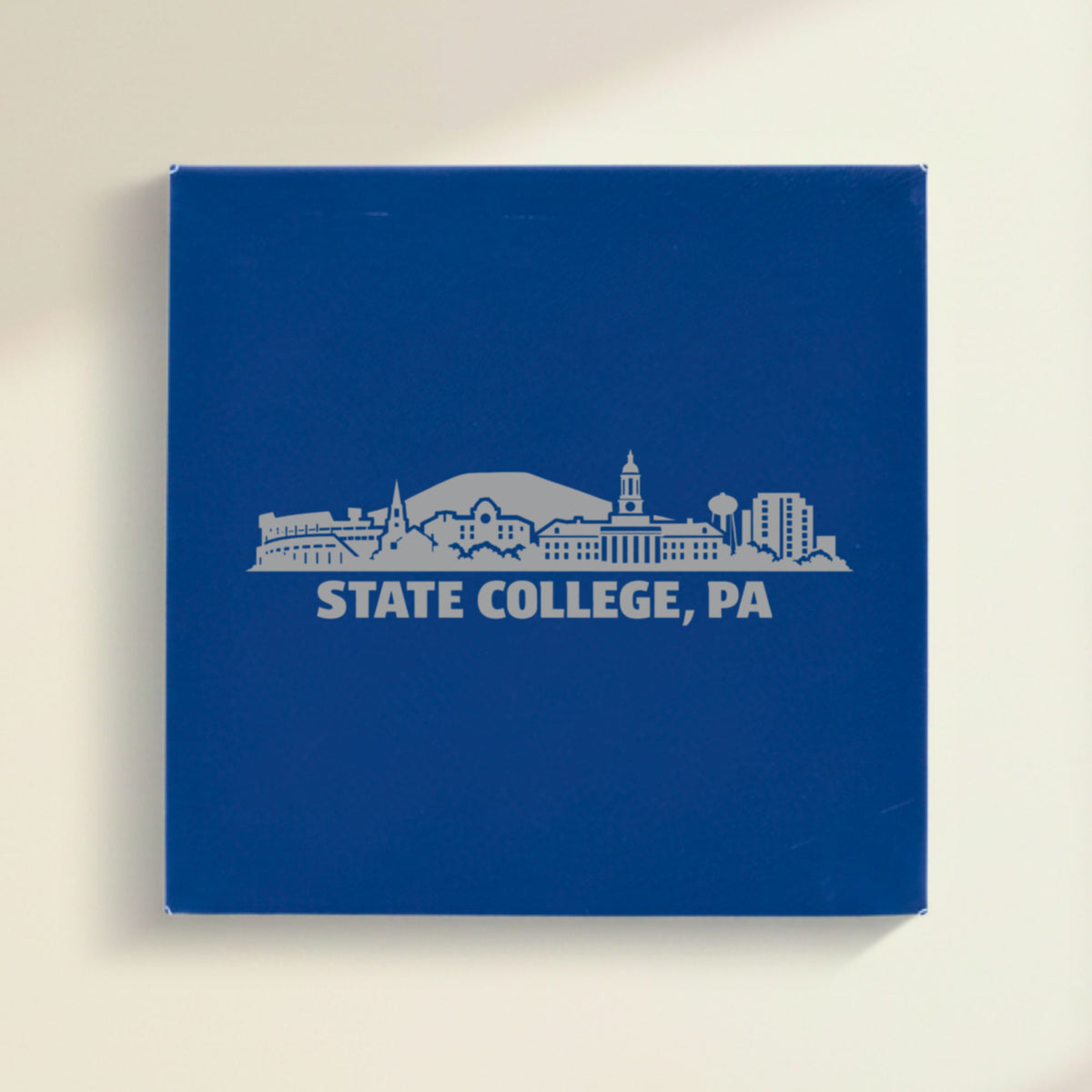 Close up of the State College, Pennsylvania skyline engraved on Blue leatherette