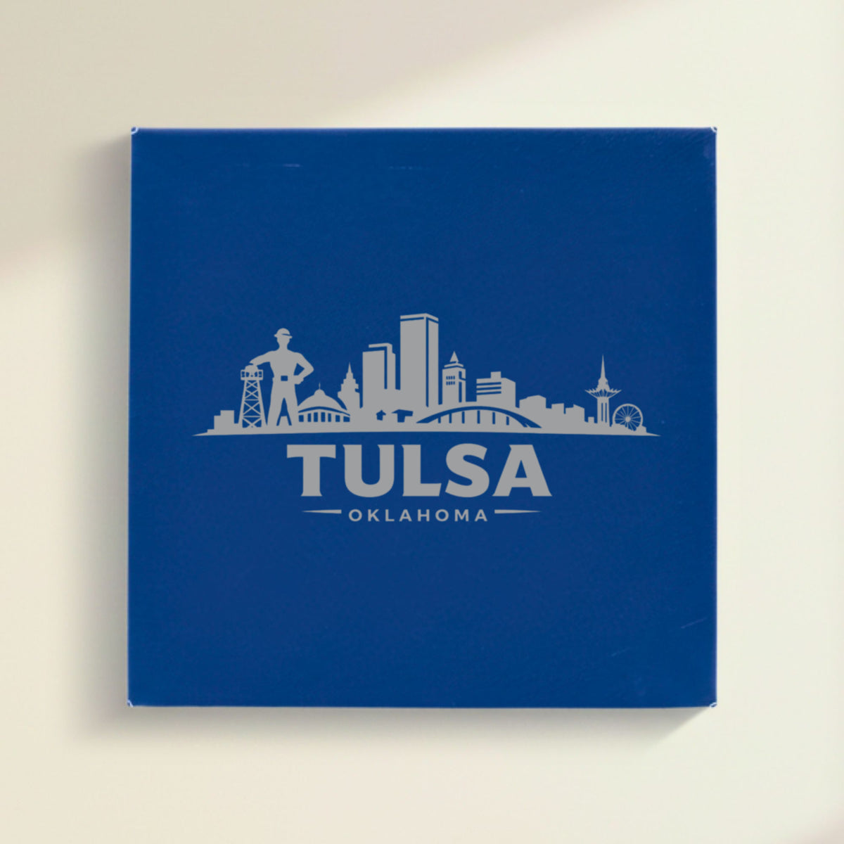 Close up of the Tulsa, Oklahoma skyline engraved on Blue leatherette