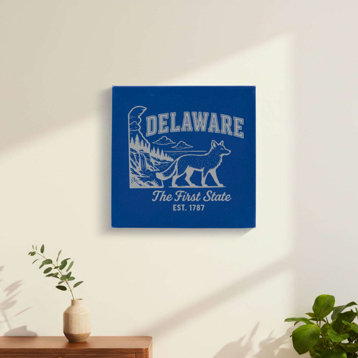 Blue leatherette wall sign engraved with a Delaware design of a gray fox, a waterfall and pine forest, hanging on a wall
