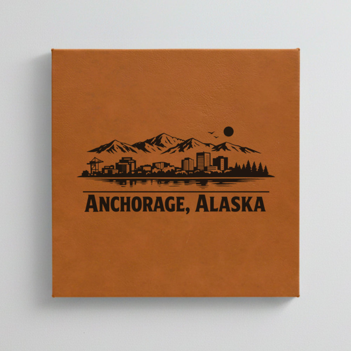 Close up of the Anchorage, Alaska skyline engraved on Brown leatherette