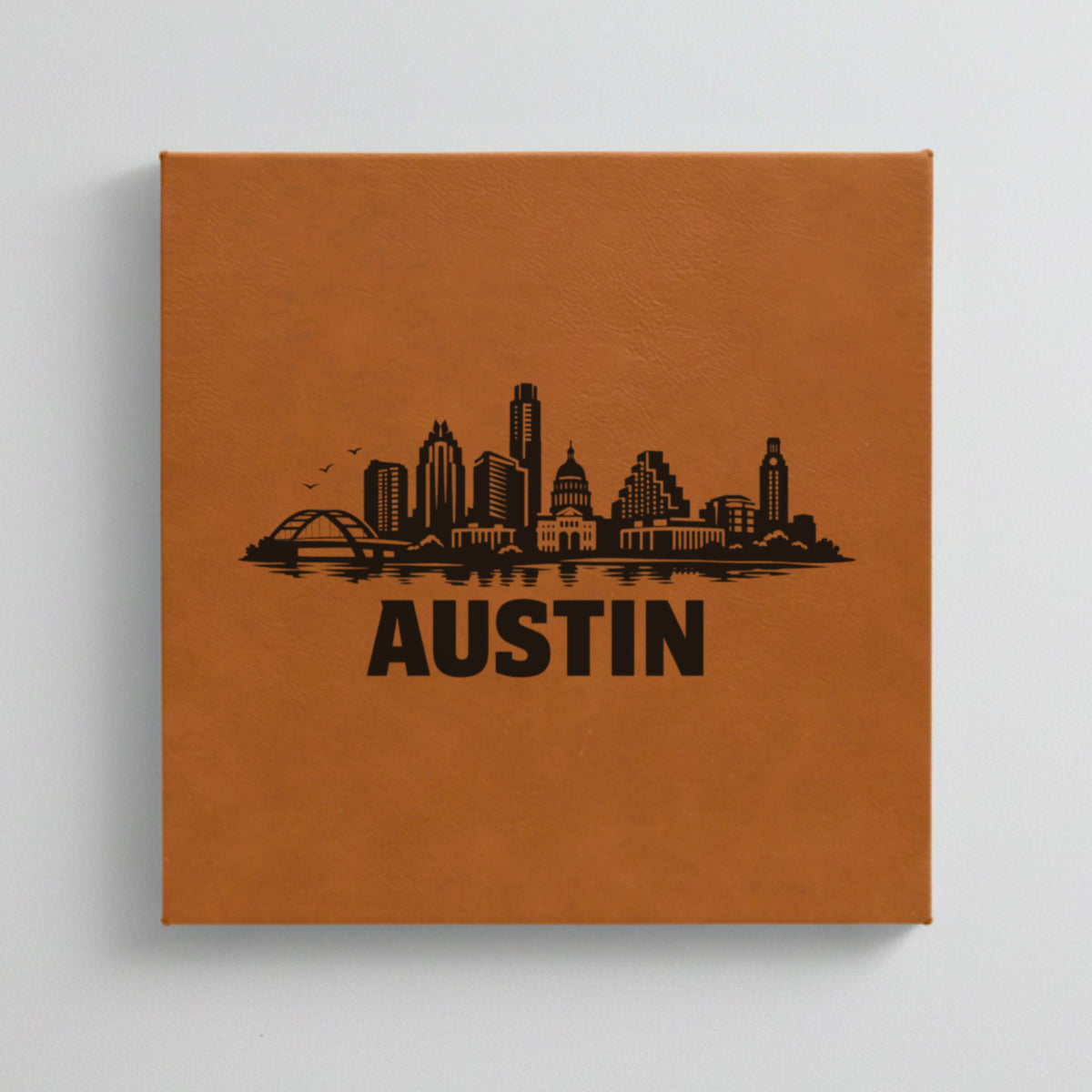 Close up of the Austin, Texas skyline engraved on Brown leatherette