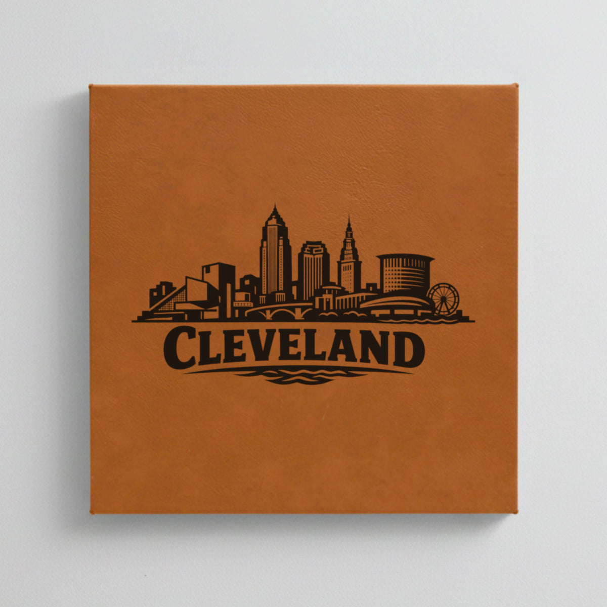Close up of the Cleveland, Ohio skyline engraved on Brown leatherette