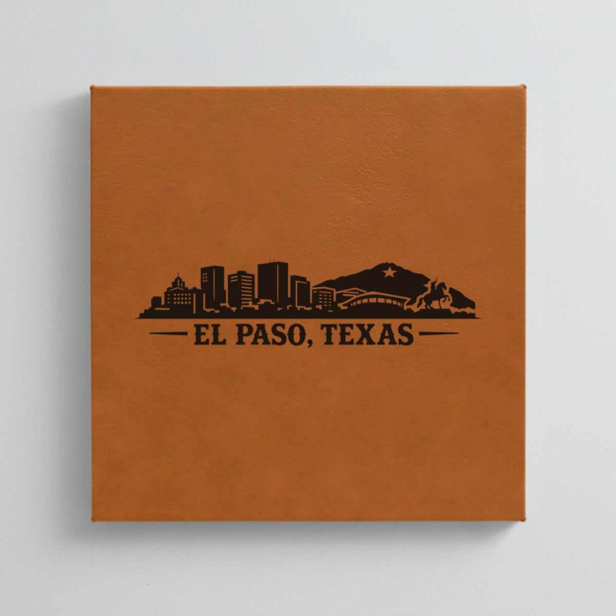Close up of the El Paso, Texas skyline engraved on Brown leatherette