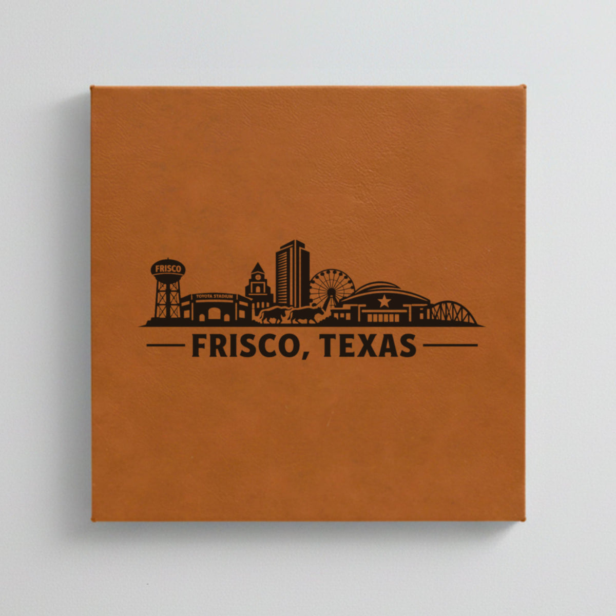 Close up of the Frisco, Texas skyline engraved on Brown leatherette