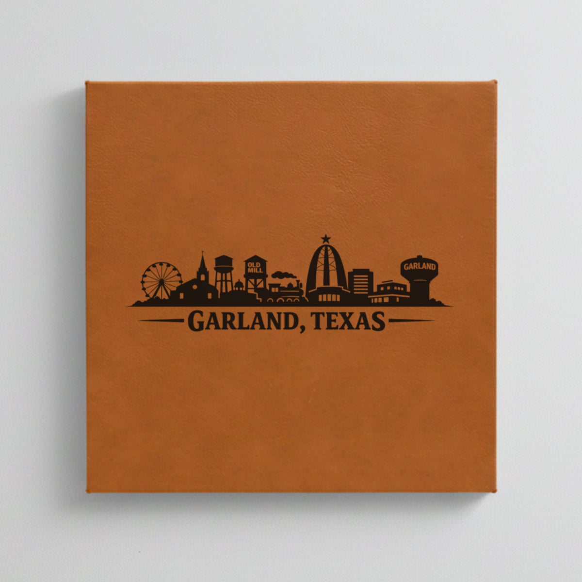 Close up of the Garland, Texas skyline engraved on Brown leatherette
